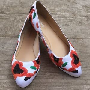 White flats embroidered with red poppies